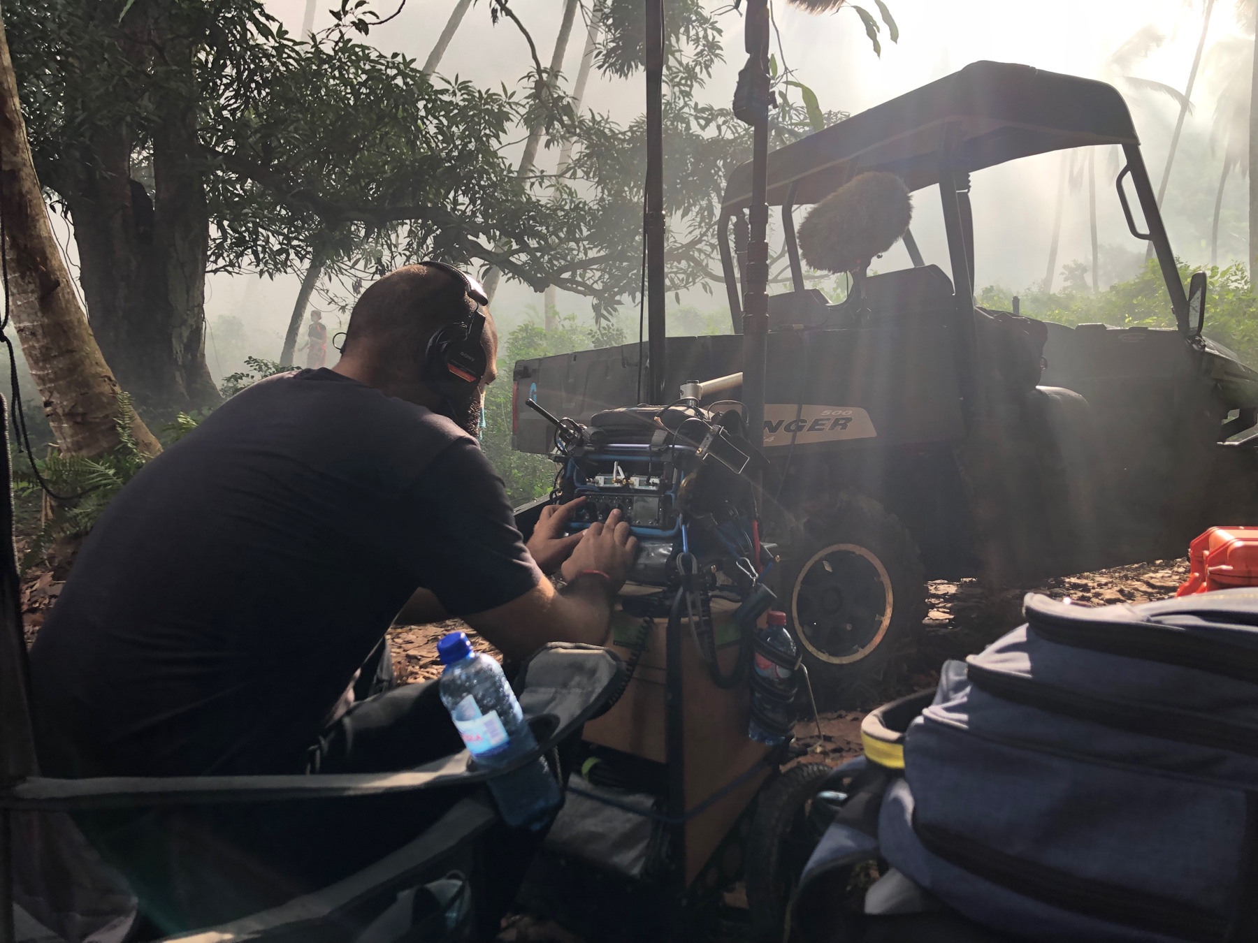 Marco Tato Vargas working at a production sound cart on location